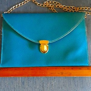 Turquoise blue leather clutch handbag